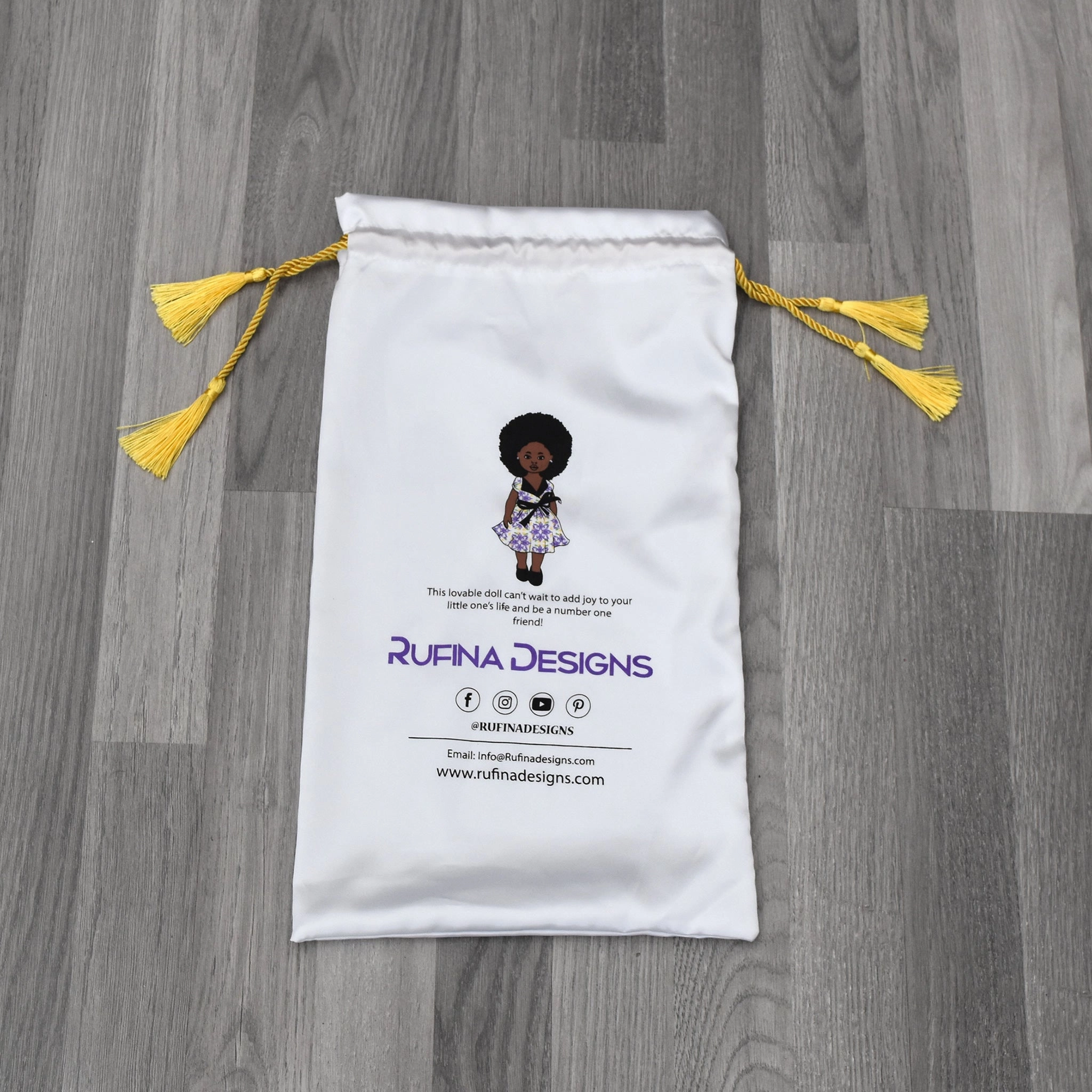 Black baby boy doll in African Print Shirt - Kanelo