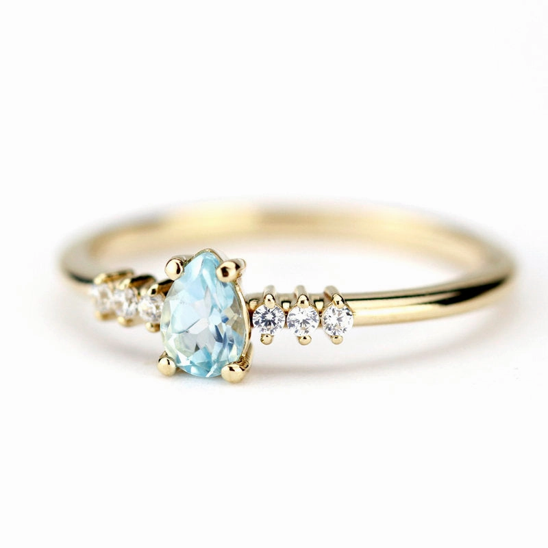 engagement ring blue topaz and diamond pear shaped tear drops