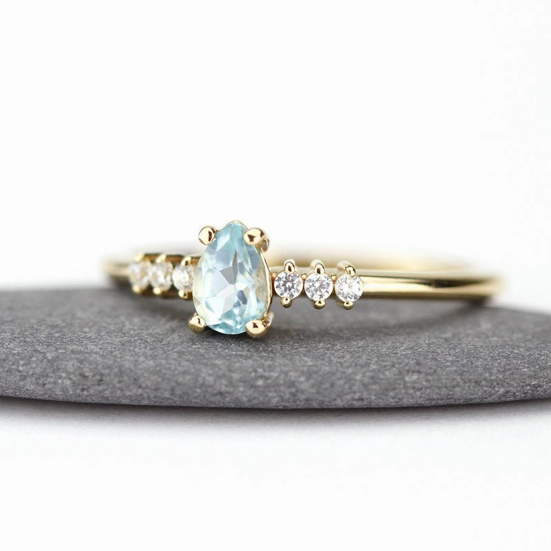 engagement ring blue topaz and diamond pear shaped tear drops