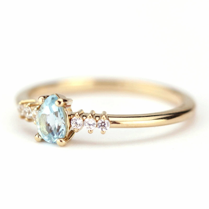 engagement ring blue topaz and diamond pear shaped tear drops