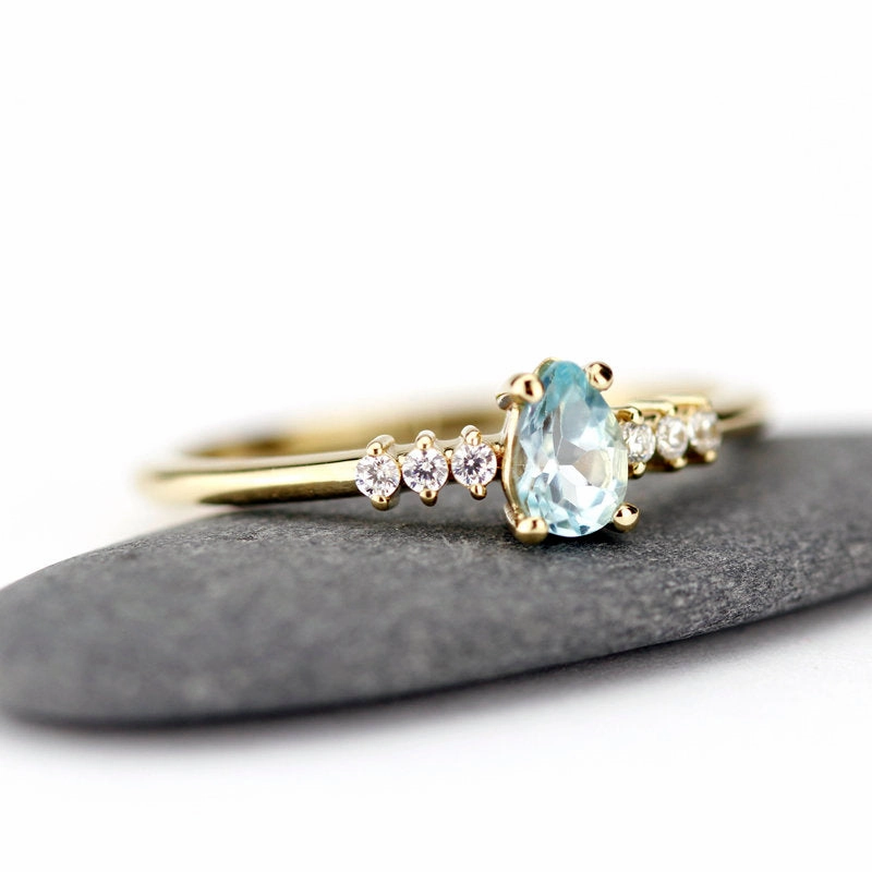engagement ring blue topaz and diamond pear shaped tear drops